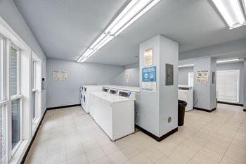 A laundry room with washers and dryers at Peachtree Place Apartments, South Carolina, 29210